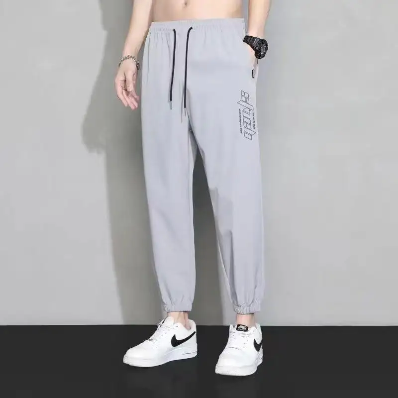 

Ледяной шелк Свободный крой Летние тонкие рабочие брюки Высокая талия Девять точек Спортивные свободные повседневные брюки для мужчин Qui Dry