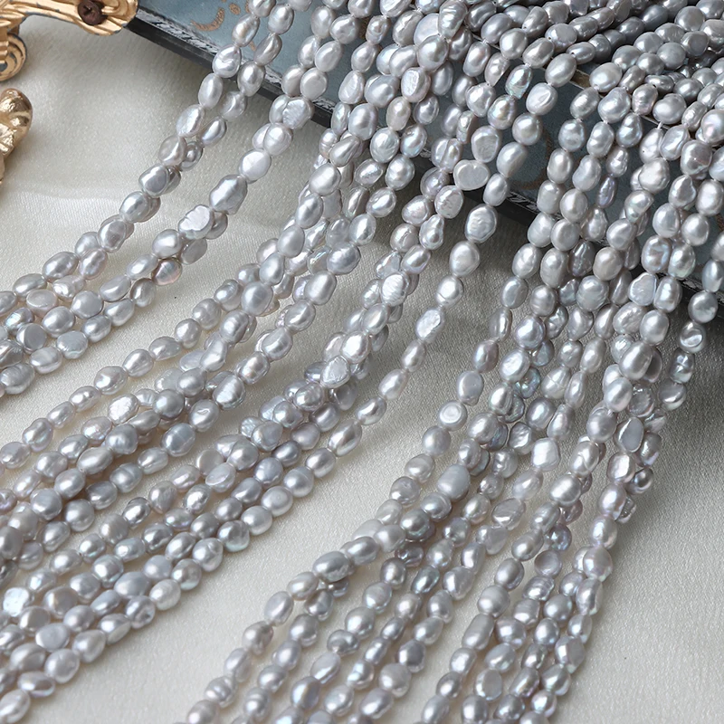 4.5-5mm straight-hole irradiated gray two-sided glossy Baroque DIY strand, approximately 37cm long.