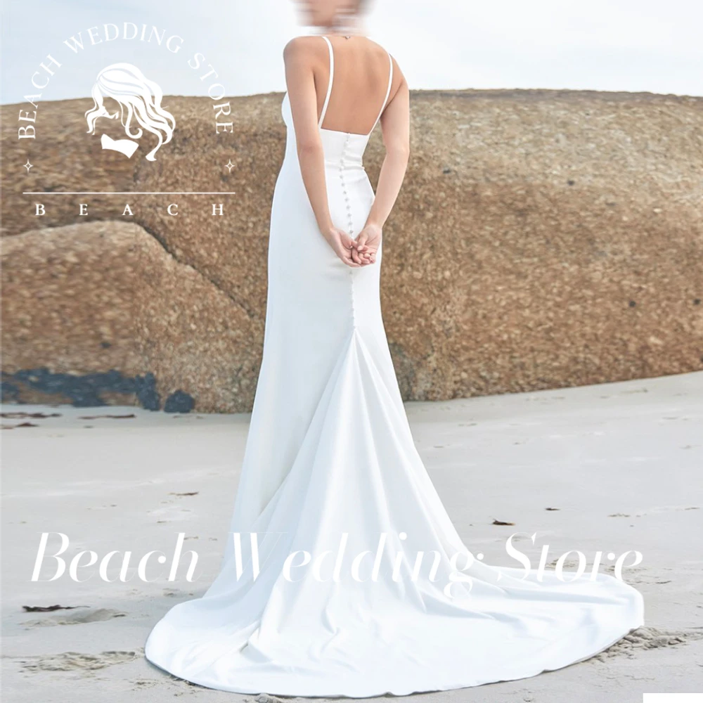 

Beach Customized Spaghetti Straps Beach Mermaid Wedding Dresses Cut Out Ivory Backless Bride Dress Bohemian Sleeveless Bow