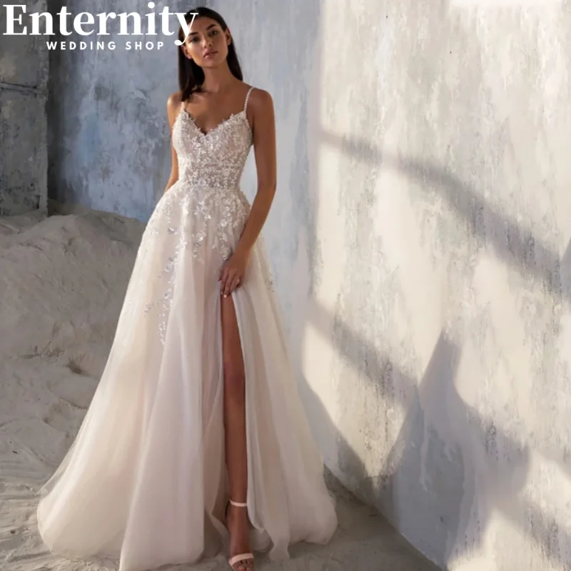 Customized Lace Appliqued Wedding A-line Dress Side Slit Backless Spaghetti Straps Sleeveless Beach Robe Customized Gowns