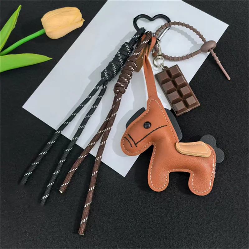 جديد INS نمط الجلود الحصان العام حقيبة الهاتف المحمول حبل معلق الإبداعية الهاتف الحقيبة المفاتيح ملحق من البر الرئيسى للصين