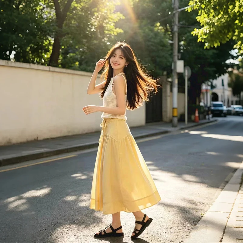 Summer New Women's Yellow Pleated Skirt High Waisted Metal Ring Lace-Up Design Ladies Fashionable and Loose Midi Jupe