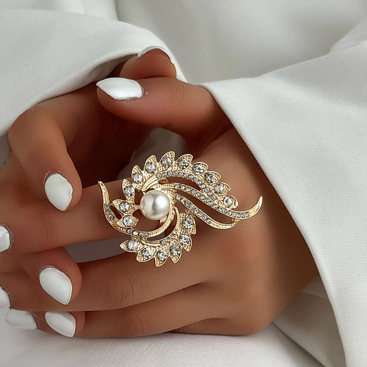 

Elegant, irregularly rotating flower ring with an adjustable open band. Perfect for her on her anniversary.