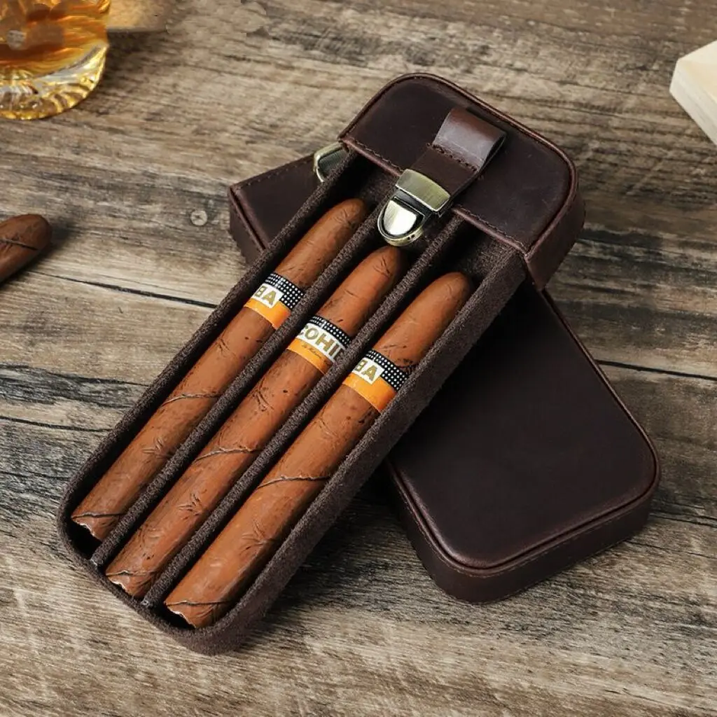 

A Portable Travel Cigar Case Made Of Cowhide, With 3 Slots For Cigar Storage, A Desiccator Cover, And a Storage Box. Handmade.