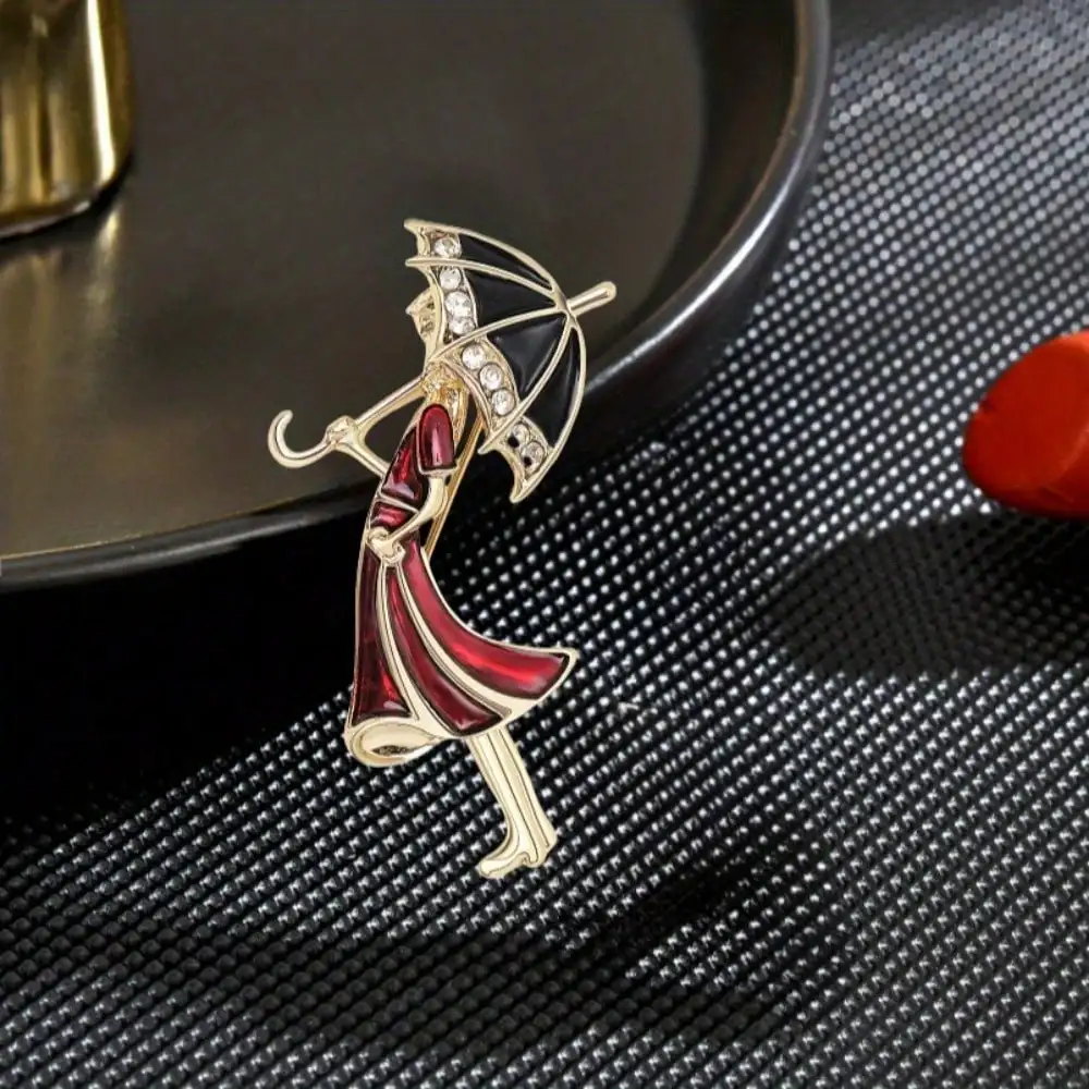 Emaille-Brosche mit Vintage-Eleganz-Lady-Regenschirm – schwarzer Regenschirm, rotes Kleid-Design, schmückt Kleidung, ideal für Vintage-Geschenke