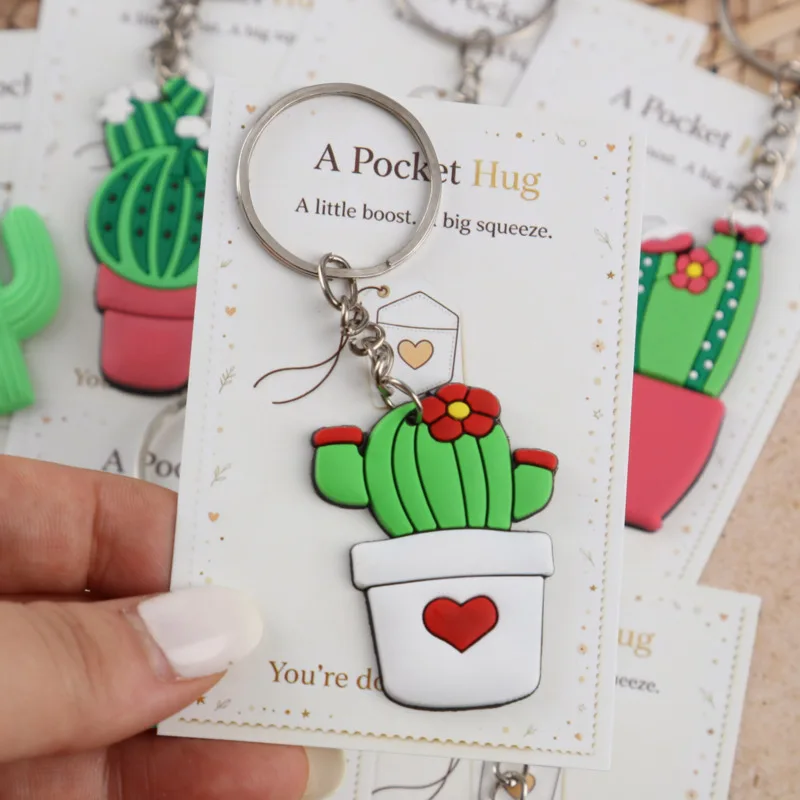 Ensemble de 12 porte-clés de la série Cactus Positif et Optimiste 2D, livré avec une carte de vœux de poche. Le cadeau d'encouragement parfait.