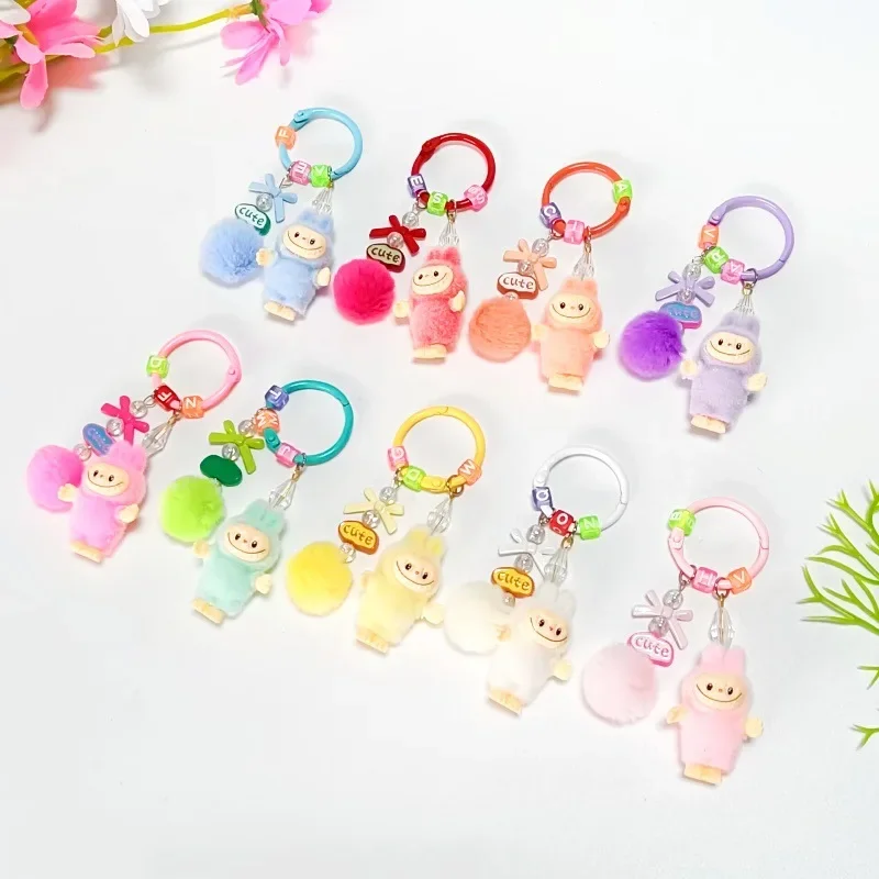 

Flocking standing bow ball Labubu cute particle keychain pendant creative cartoon mobile phone chain bag hanging ornament