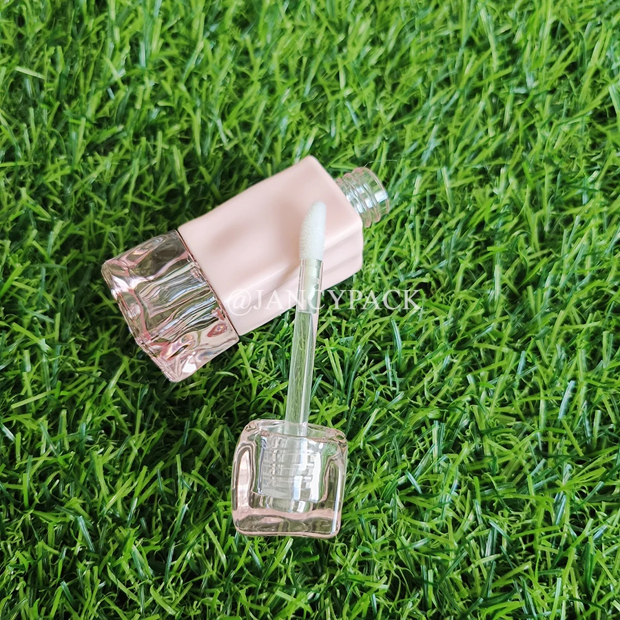 تصميم جديد 2 مل الوردي تويست فريد أنبوب ملمع الشفاه الفارغ أنابيب زيت الشفاه شعار مخصص تغليف مستحضرات التجميل