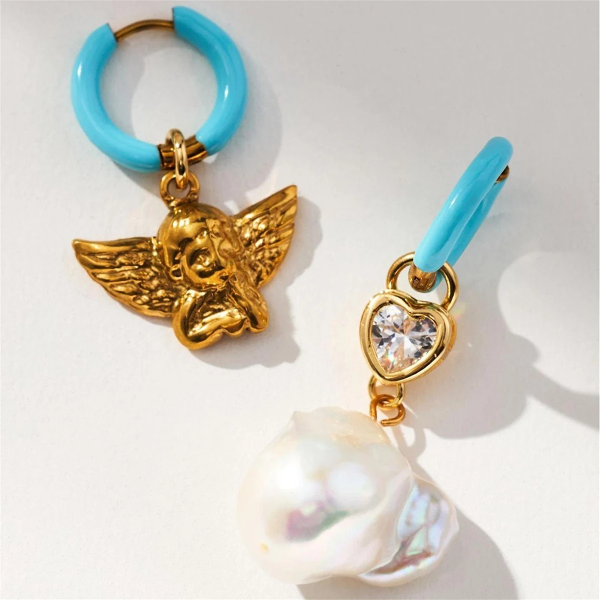 

Instagram style angel baby pearl inlaid zirconium earrings earrings, gold plated and color preserving earrings