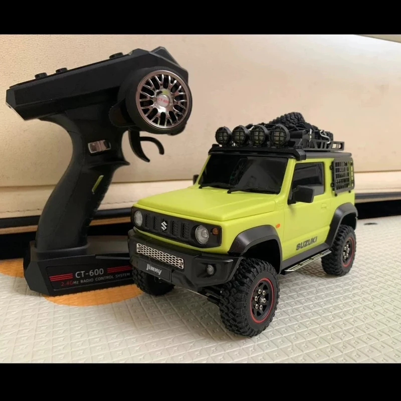 Suzuki Jimny-chasis de simulación de coche a Control remoto, accesorios de estado de ánimo modificados, modelo 4x4, 1/16