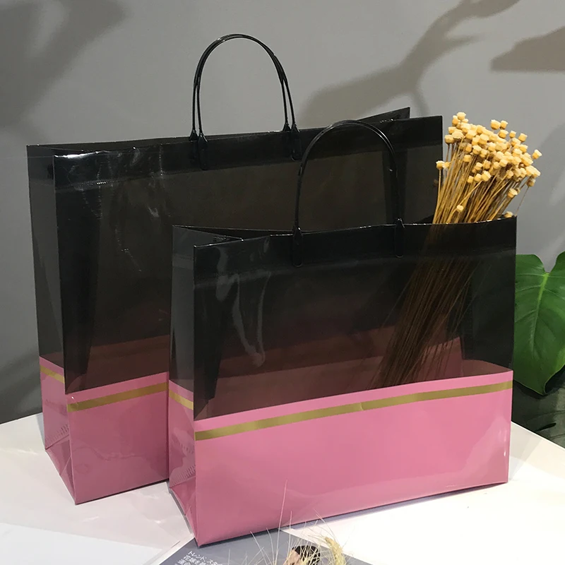 厚みのある防水pvcラミネート不織布製ハンドヘルドショッピングバッグ、子供服向け、クラシックカラーの拼接デザイン、シンプル