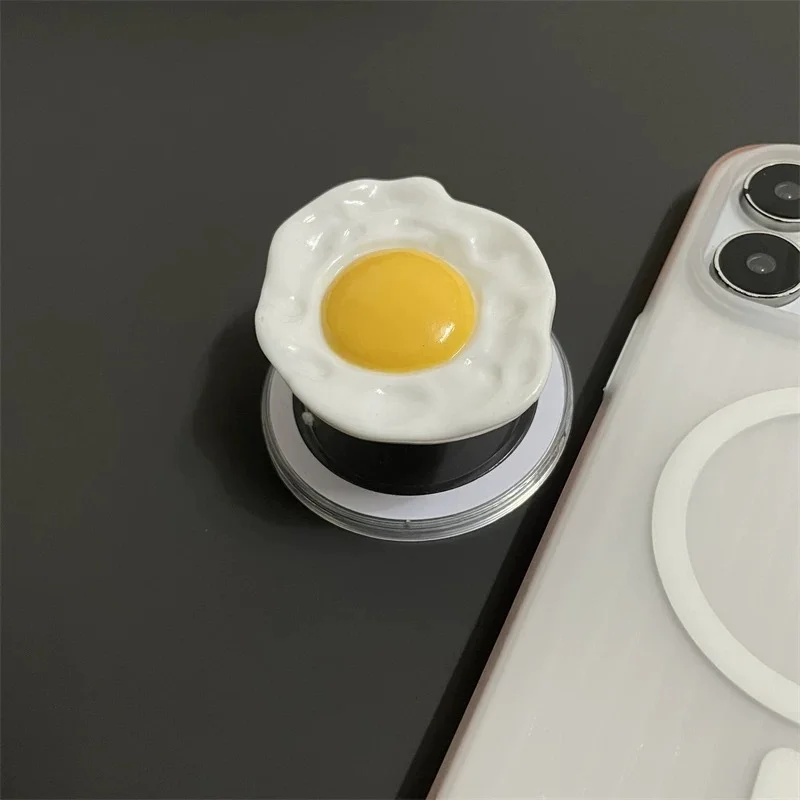 Kreatywny uchwyt na telefon w kształcie jajka z MagSafe, składany uchwyt z mocowaniem na telefon, uchwyt na palec z pierścieniem do iPhone'a i Samsunga, bezpieczny, rozkładany stojak.