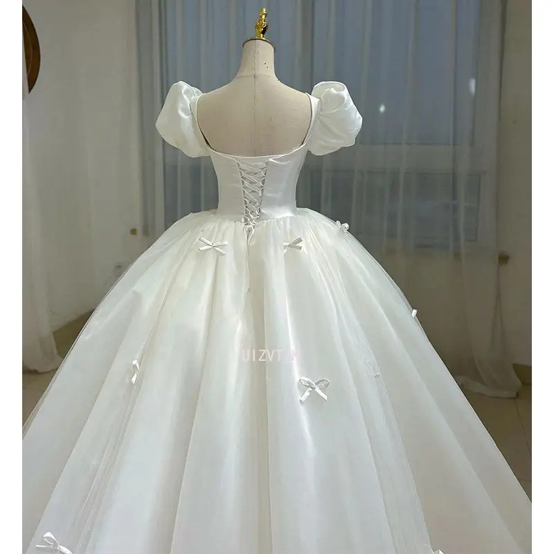 Vrouwen Licht Luxe Wit Satijn Kant Lieverd Kralen Kleine Strik Korte Bladerdeeg Mouw Bruid Baljurk Aangepaste Trouwjurk