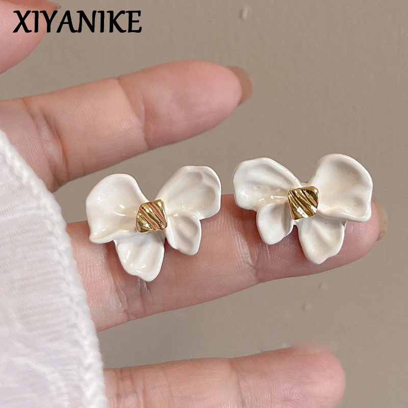 

XIYANIKE Cute Plant Bowknot Flower Ear Stud Piercing Earrings For Women Summer Fashion New Jewelry Gift Party Wedding