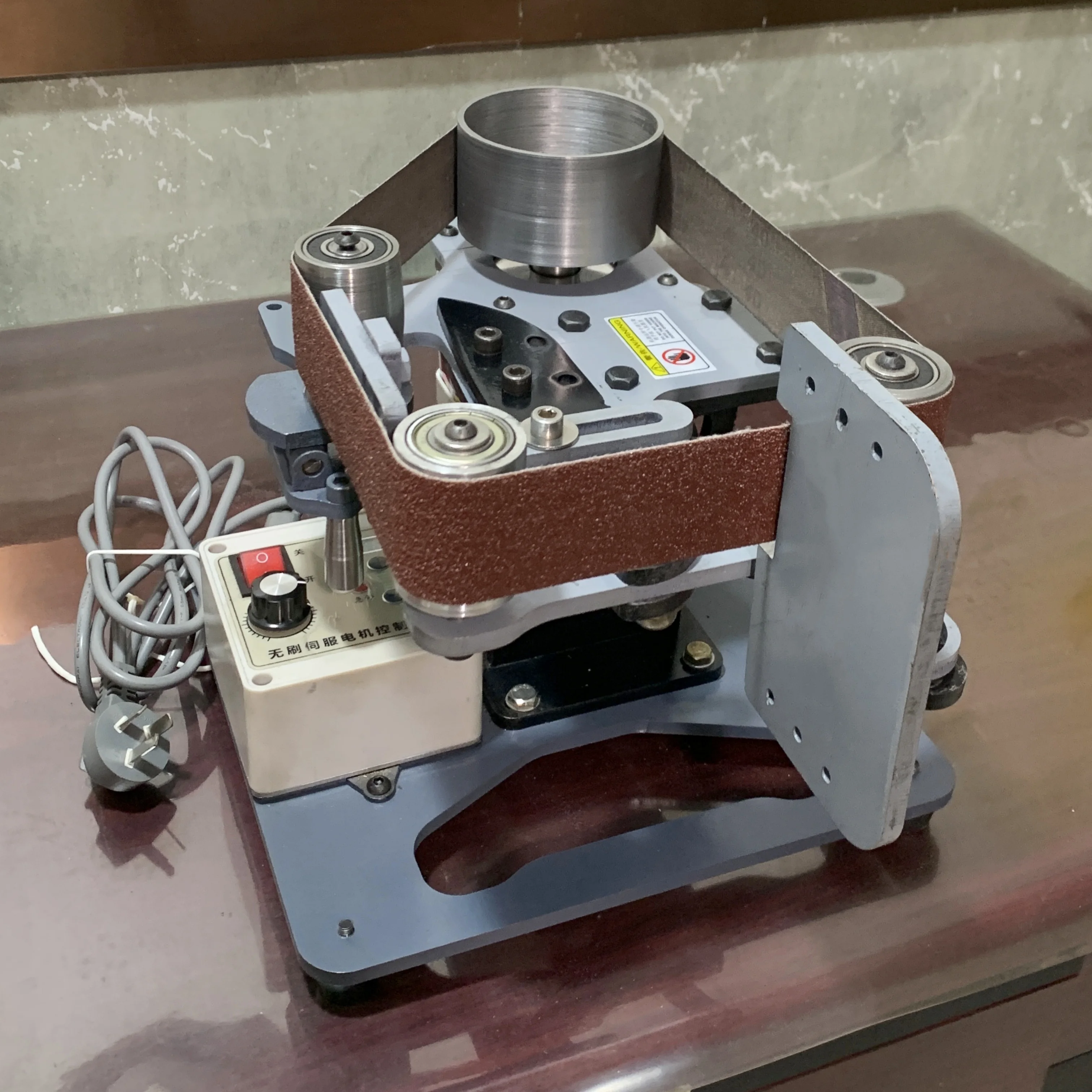 

Compact Vertical/Horizontal Brushless Belt Sander with Angle Adjustment and V-Groove Cutting