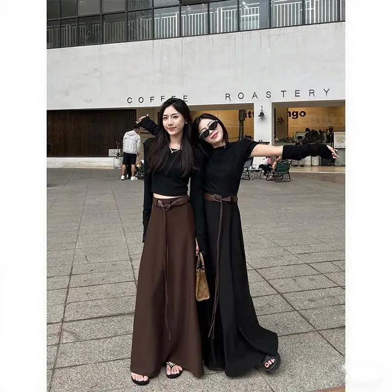 Modna, uniwersalna, wyszczuplająca spódnica w kształcie litery A, długa, damska, w stylu francuskim, niszowa, z wysokim stanem, zwisająca, do połowy łydki.