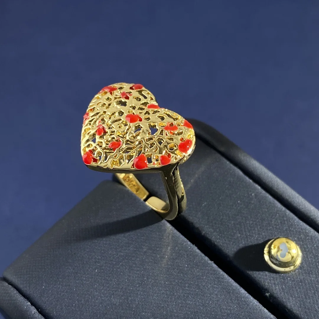 

Simple temperament Vintage palace style red enamel drip oil hollowed out heart-shaped peach heart open ring