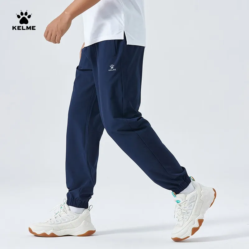 Kelme Męskie spodnie sportowe Tkane elastyczne legginsy Spodnie treningowe do biegania Casual Spodnie do ćwiczeń na świeżym powietrzu na siłownię