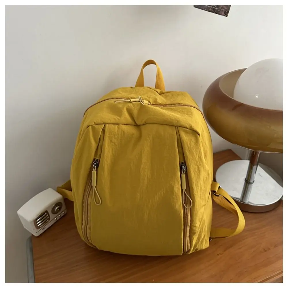 حقيبة ظهر عصرية من النايلون بلون سادة وخفيفة الوزن ذات سعة كبيرة وحقيبة كتف بسحاب مزدوج للسفر