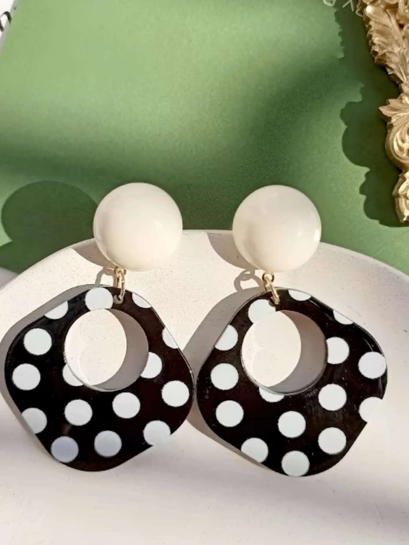 A Pair of Black and White large Polka Dot Hollow Geometric Shape Nostalgia Harbor Wind Earrings