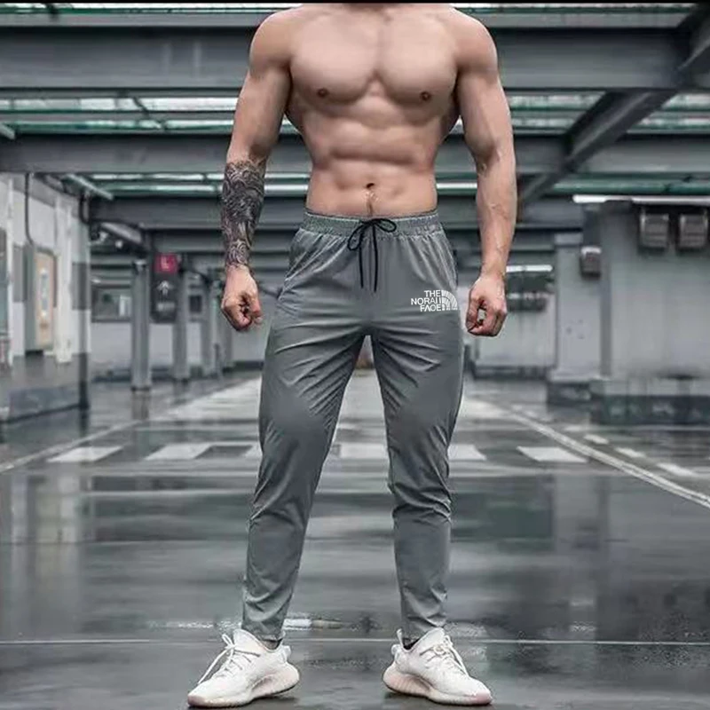 Calças esportivas elásticas para homens moletom de corrida para treinamento ao ar livre calças de ginástica leggings de bolso com zíper verão