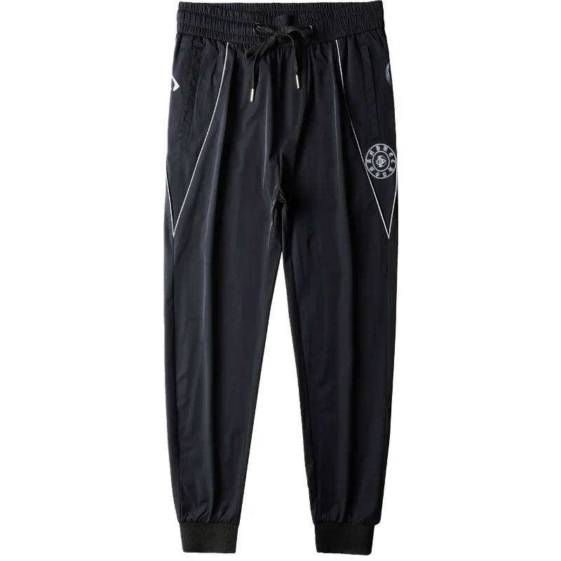 

Summer thin ice silk cool and breathable letter printed elastic slim fit small foot binding casual sports pants for men