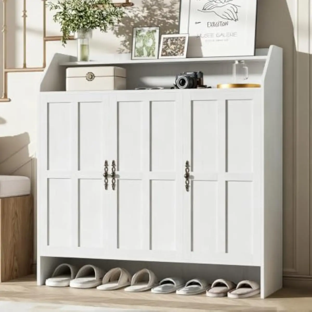 47-inch farmhouse-style shoe cabinet with three hinged doors, adjustable shelves, dual-tier open top rack, raised base, soft-clo