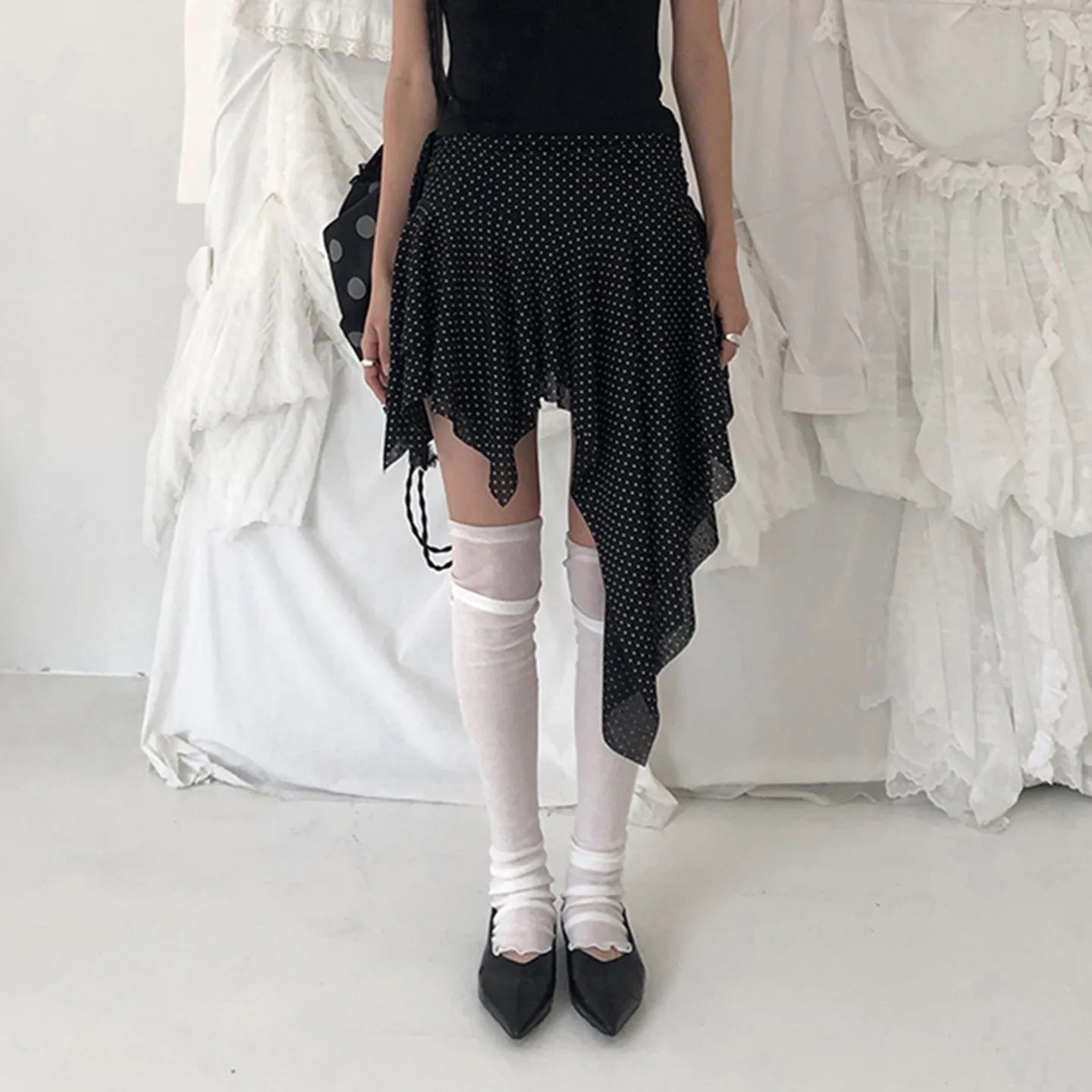 Europe and the United States dark polka-dot printed low-waisted skirt sexy slim mesh stitching irregular skirt in summer.