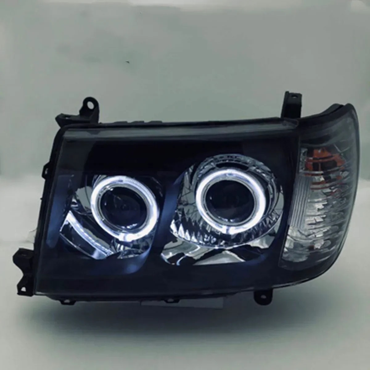 

For Toyota Land Cruiser LC100 4700, Angel Eye Daytime Running Light Drl Turn Signal with Projector Lens Car LED Headlight