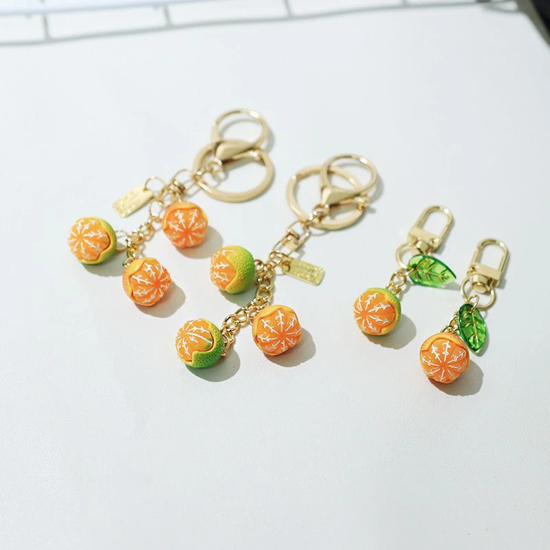 Niedlicher 3D-Simulations-Schlüsselanhänger in Orangenform mit Blatt, Frucht-Schlüsselring, Taschenanhänger, Schlüssel- und Kopfhörer-Anhänger, Schmuck-Geschenk