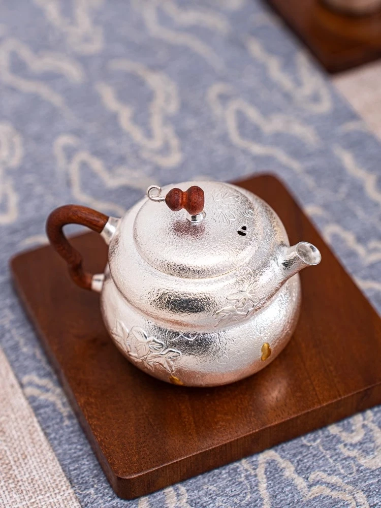 

Handmade Pure Silver 999 Tea Making Pot Inlaid with Gourd Insulation Traditional Craft Silver Pot for Brewing Tea