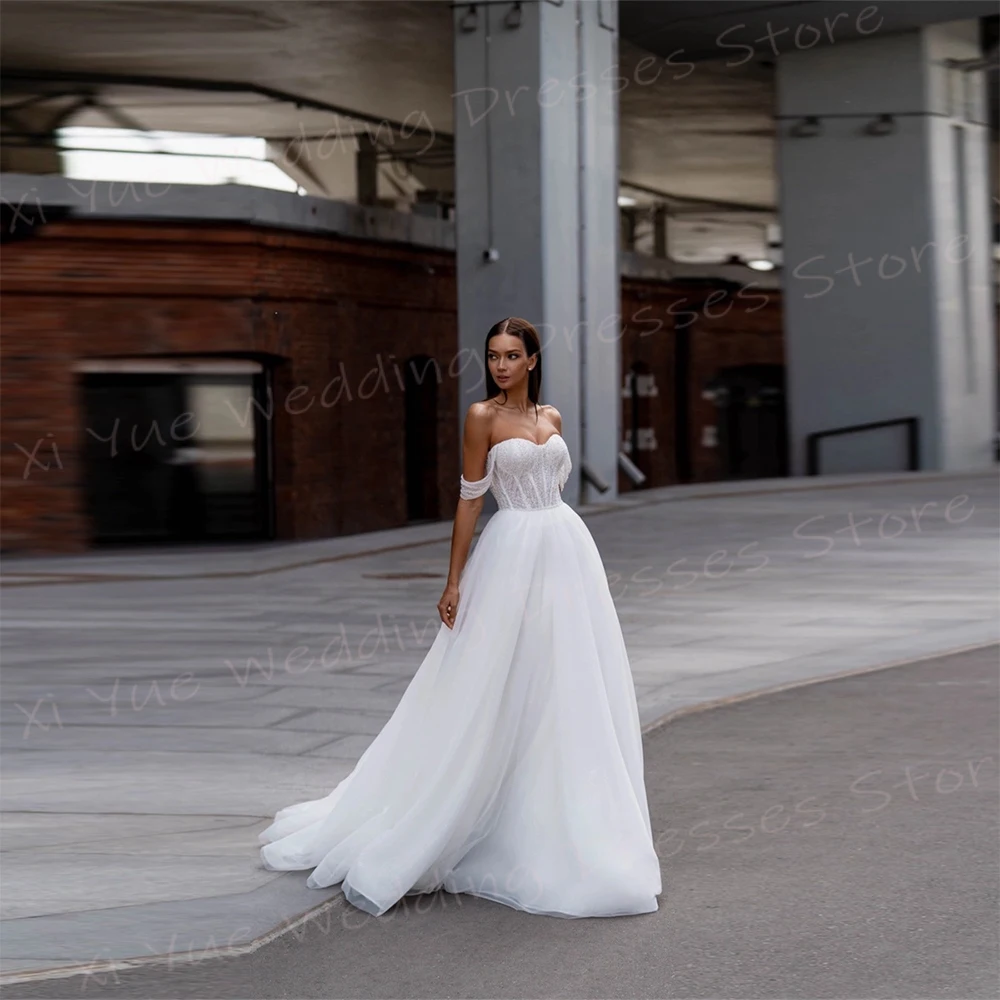 Elegancka linia damska suknie ślubne Off The Shoulder suknie panny młodej dostosowane Vestidos De Novia Boda seksowna bez rękawów Backless