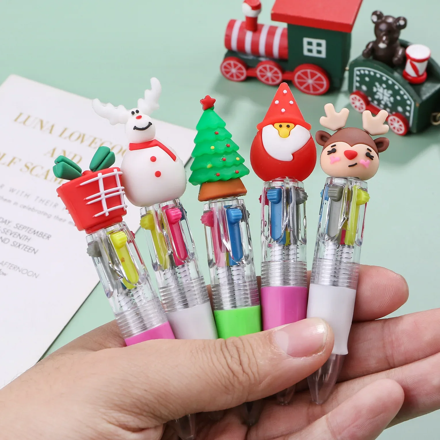 24PCS Christmas Mini Four Color Ballpoint Pen Cartoon Little Deer Old Man Four Color Grease Pen Handbook Color Push Pen Gift