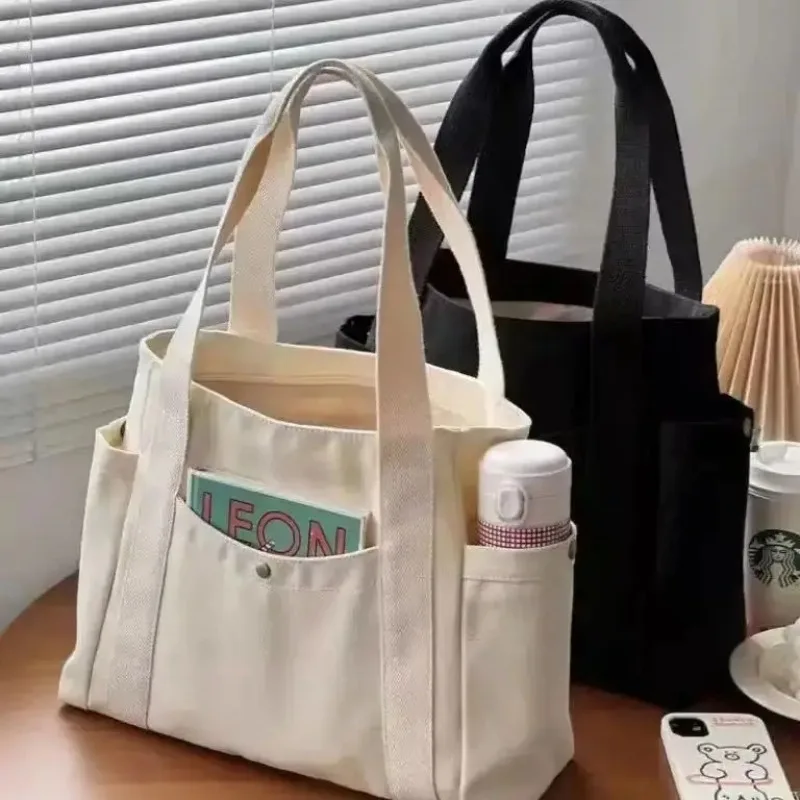 Bolso de lona para mujer, gran capacidad, múltiples bolsillos exteriores, bolso de hombro con cremallera, bolso de compras para estudiantes