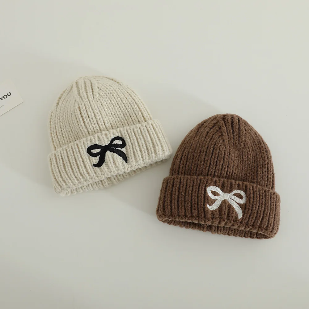 الأطفال محبوك قبعة لينة دافئة 48-52 سنتيمتر الخريف الشتاء الفتيات الفتيان يندبروف القبعات مع القوس طفل الباردة برهان قبعة الاطفال رشاقته قبعات