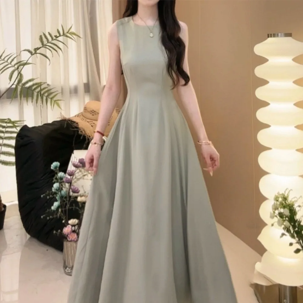Ins Fashion U الرقبة بلا أكمام فستان طويل مزاجه سترة دون أكمام بلون تنورة طويلة ألف خط طويل المرأة فستان كوري الطرف