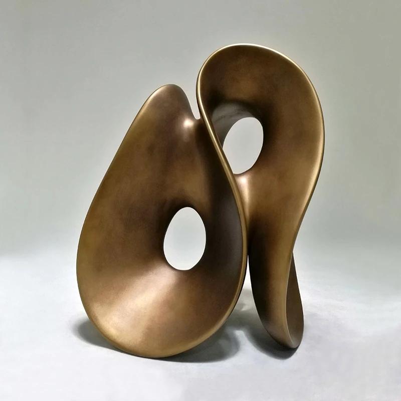 Hotel, model home, living room decor. Modern simple abstract art sculpture.