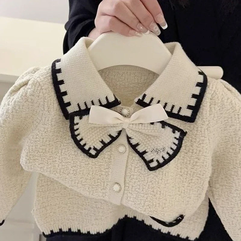 

2024 Girls' Autumn Cardigan Clothing Set Winter Sweet Bow Collar Coat+Half Skirt Children's Fashionable Style Baby Knitted Set