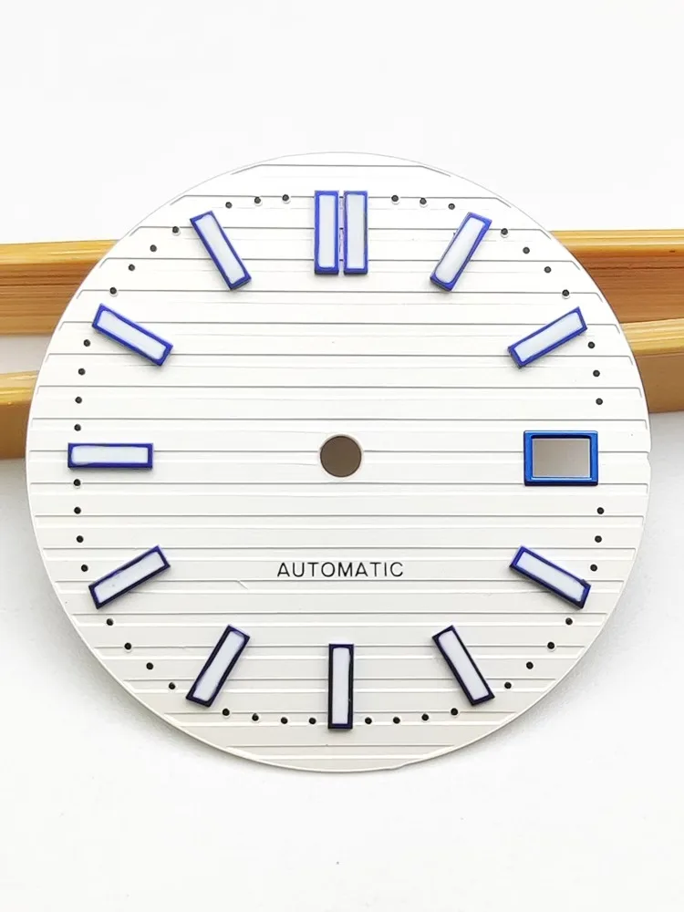 The 29.8mm dial literally applies to the NH35 calibre at three o'clock, with a green luminescent white face