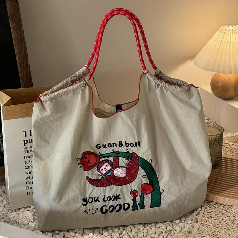 bolsa-de-ombro-de-lona-com-bordado-de-aco-ecologico-bolsa-de-ombro-de-ande-capacidade-para-mulheres-estilo-doce-e-legal