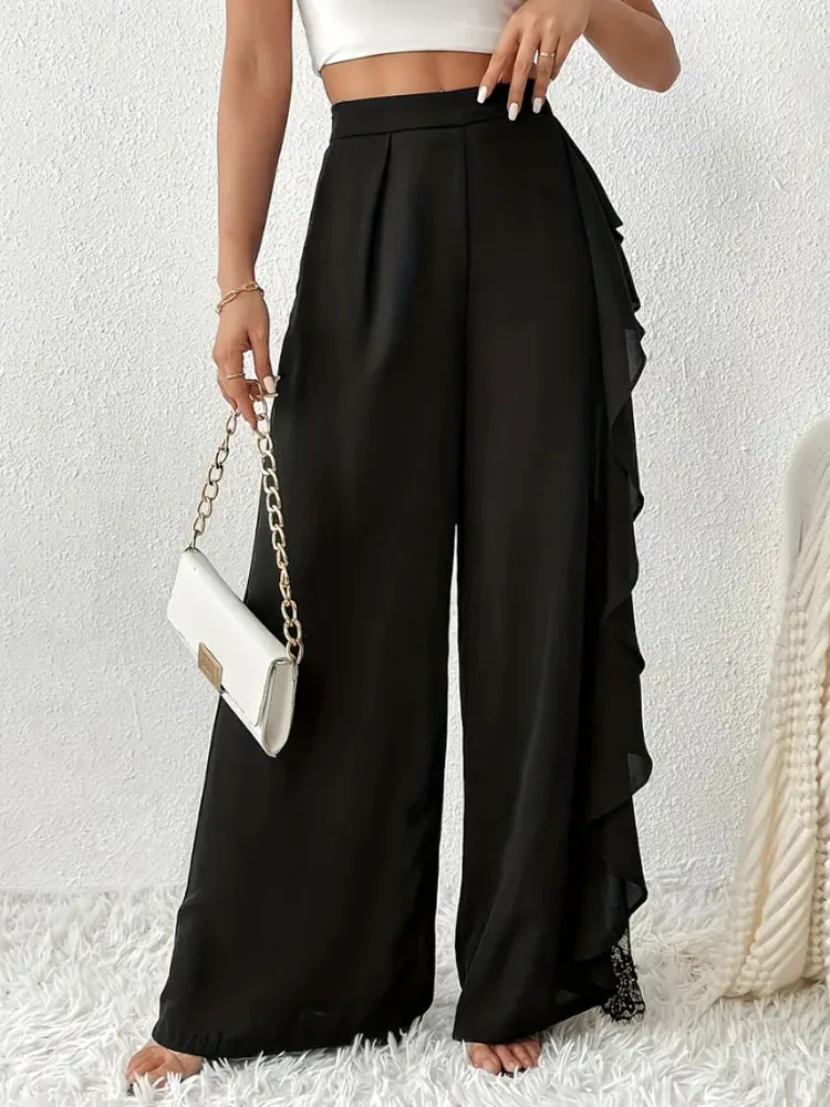 Pantaloni alla moda e cadenti in rete di pizzo irregolare a fessura a vita alta