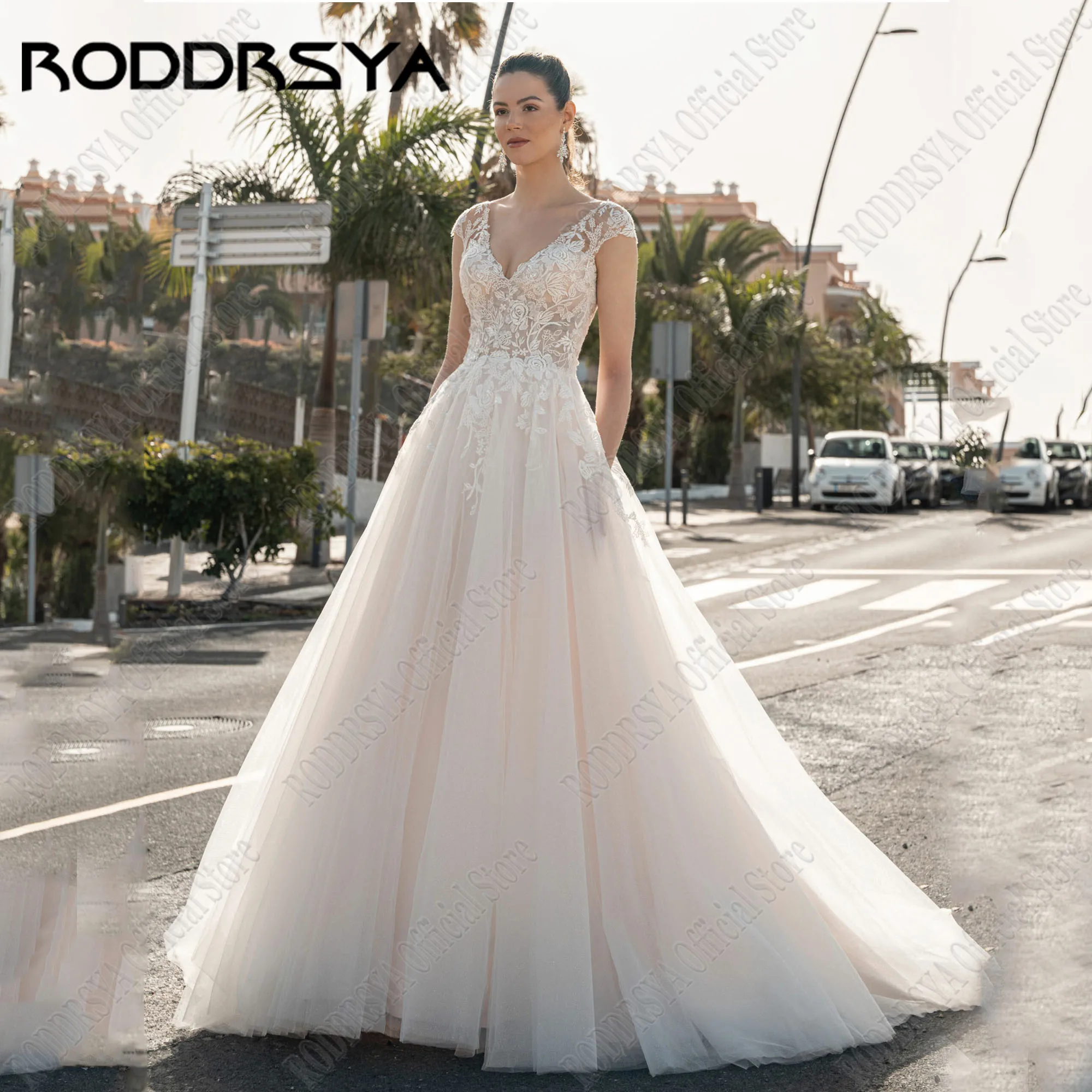 

RODDRSYA A-Line Wedding Dresses With Pocket V-Neck Backless Cap Sleeves Bride Gowns Applique Vestidos De Novia Tulle Sweep Train