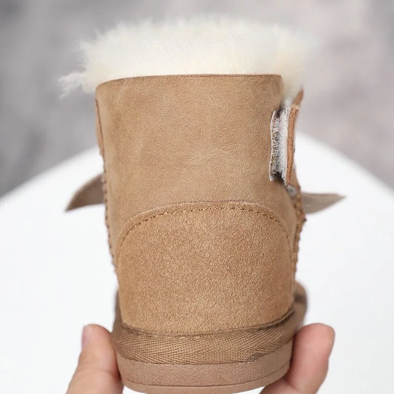 En 2022, las últimas botas de nieve para niños y piel de oveja de cuero Real 100% de piel para mantener el calor. Zapatos de moda de la más nueva