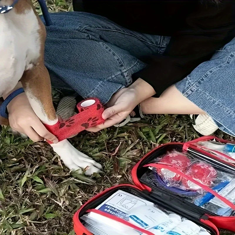 A comprehensive pet first aid kit with scissors, tweezers, tourniquets, sterile gauze and other medical and first aid supplies