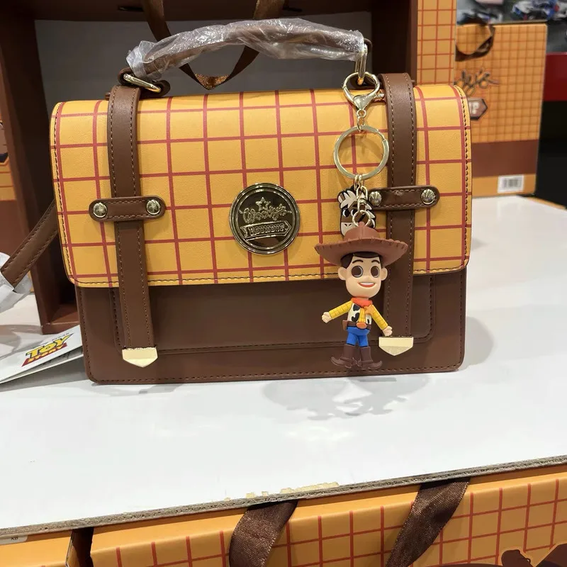 

Сумка-портфель Disney Toy Story Woody, стильная, оригинальная, на плечо, через плечо, с подвеской в виде Вуди, для женщин и девочек
