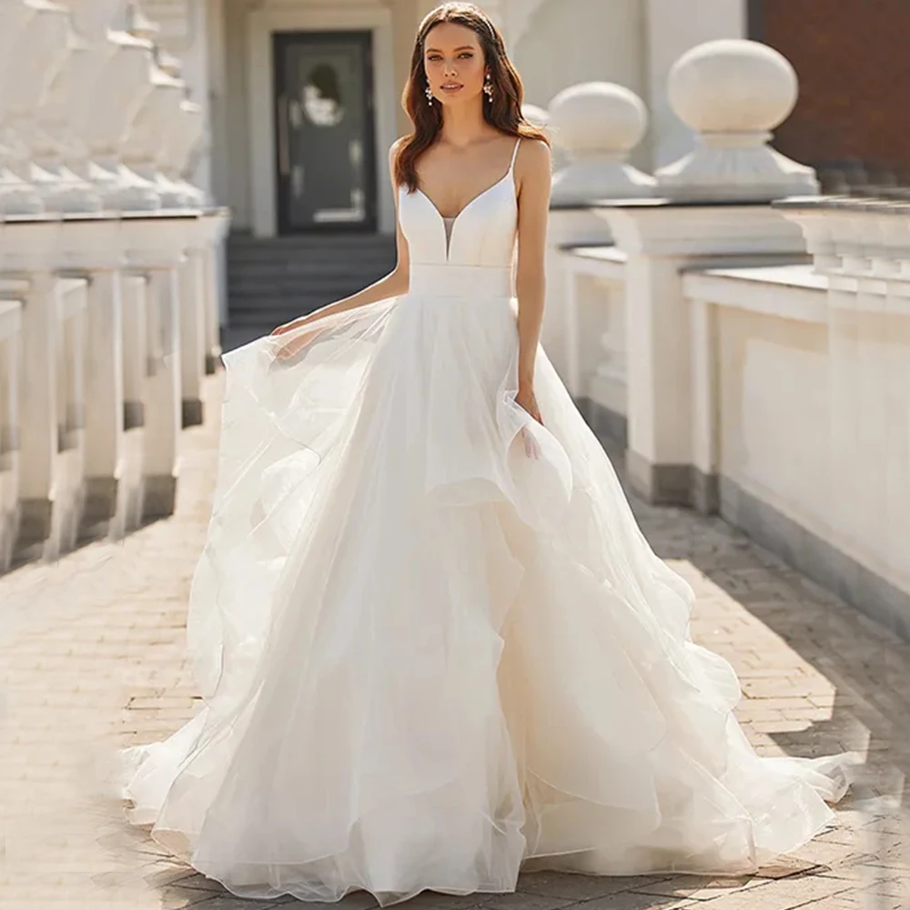 Simple Spaghetti Straps V-Neck Wedding Dress A-Line Irregular Tulle Floor Length with Sweep Train Sexy Open Back Sleeveless Gown