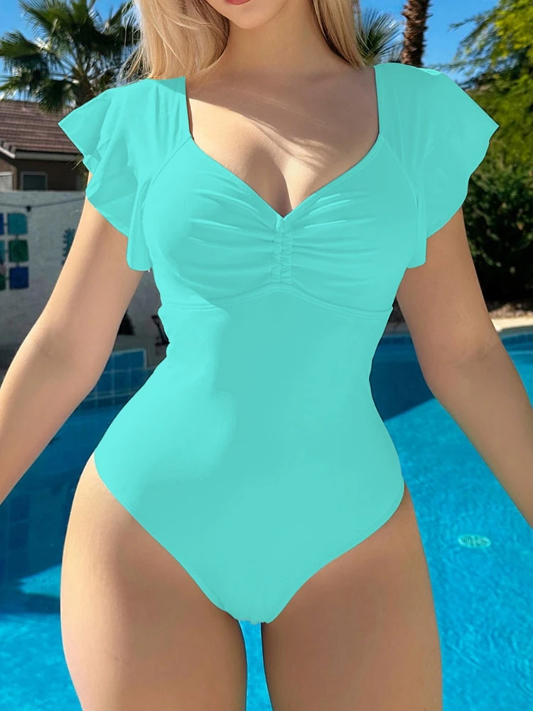 ชุดว่ายน้ำวันพีซผู้หญิง คอวี ผ้าจีบ ขอบระบาย โชว์หลัง กระชับหน้าท้อง ทรงไฮคัท สีพื้น