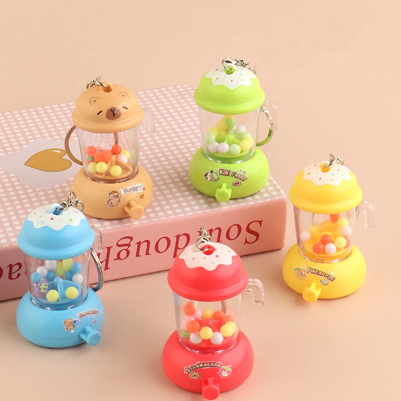 Dessin animé amusant presse-agrumes porte-clés pendentif Mini presse-agrumes breloques enfants jouets créatif sac à dos breloques accessoires presse rotatif presse-agrumes jouet