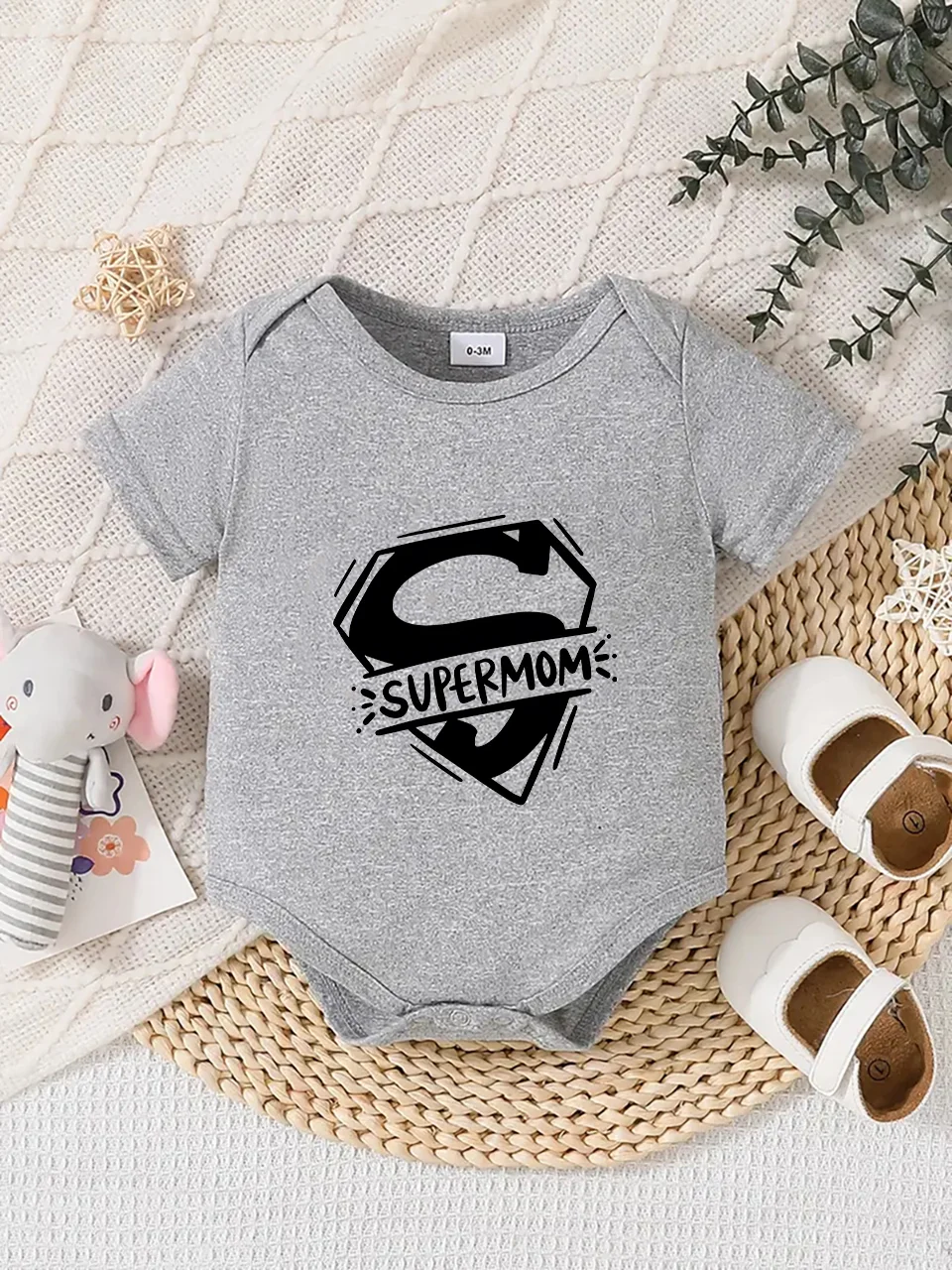 

Playful letter-printed baby short-sleeve triangle bodysuit. Button closure for easy dressing, machine washable