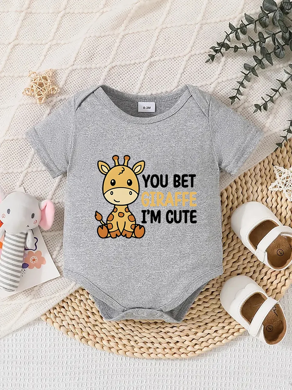 

Playful letter-printed baby short-sleeve triangle bodysuit. Button closure for easy dressing, machine washable